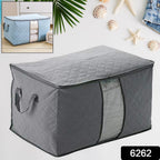 Foldable storage bag filled with blankets, showcasing its spacious capacity.