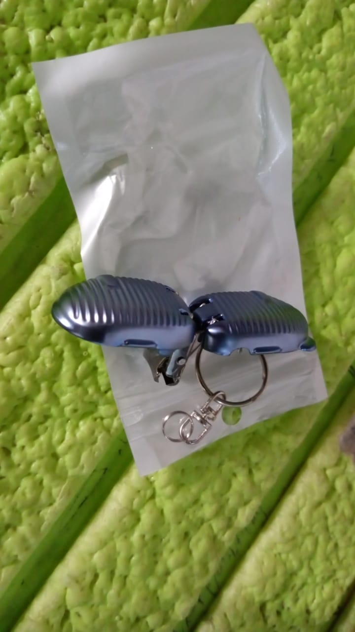 Lifestyle shot of the keychain nail clipper in a travel setting.