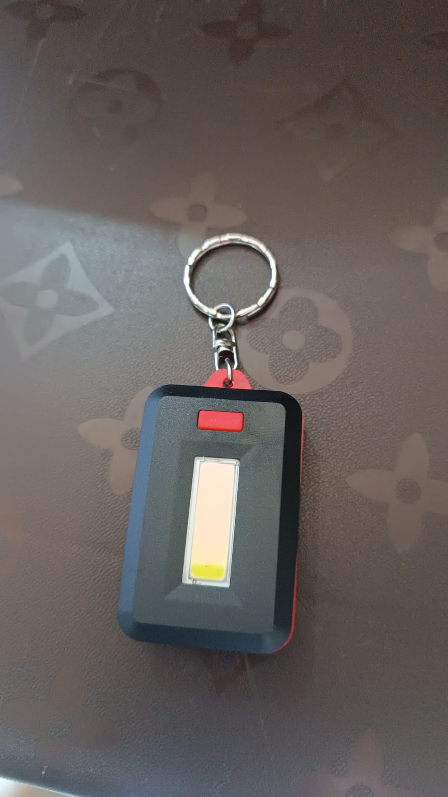 Side profile of lightweight LED keychain light for portability