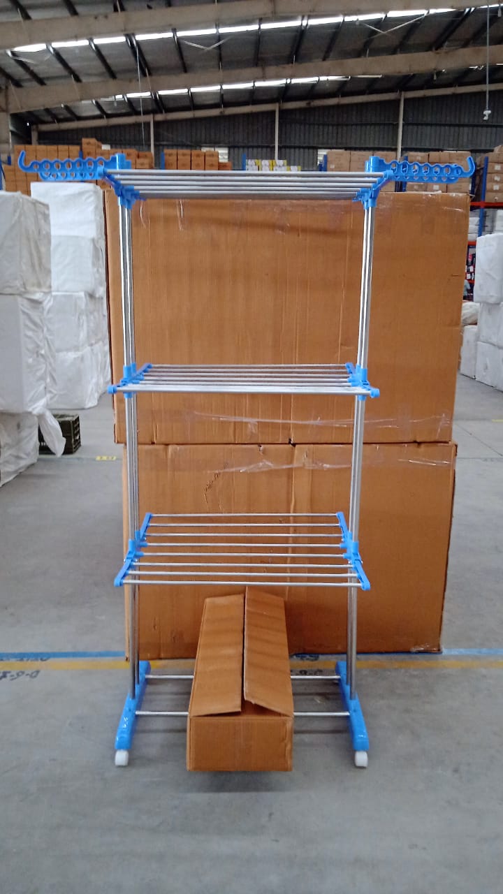 Metallic drying rack with wheels shown in folded position for storage