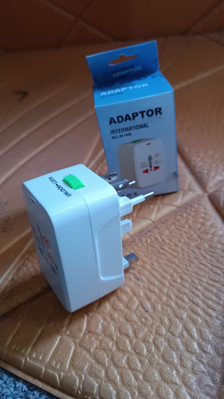 Universal travel adapter packed inside a travel bag ready for international use