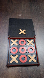 Lifestyle image of the X & Zero wooden board game, ready for play on a table, suggesting family fun.