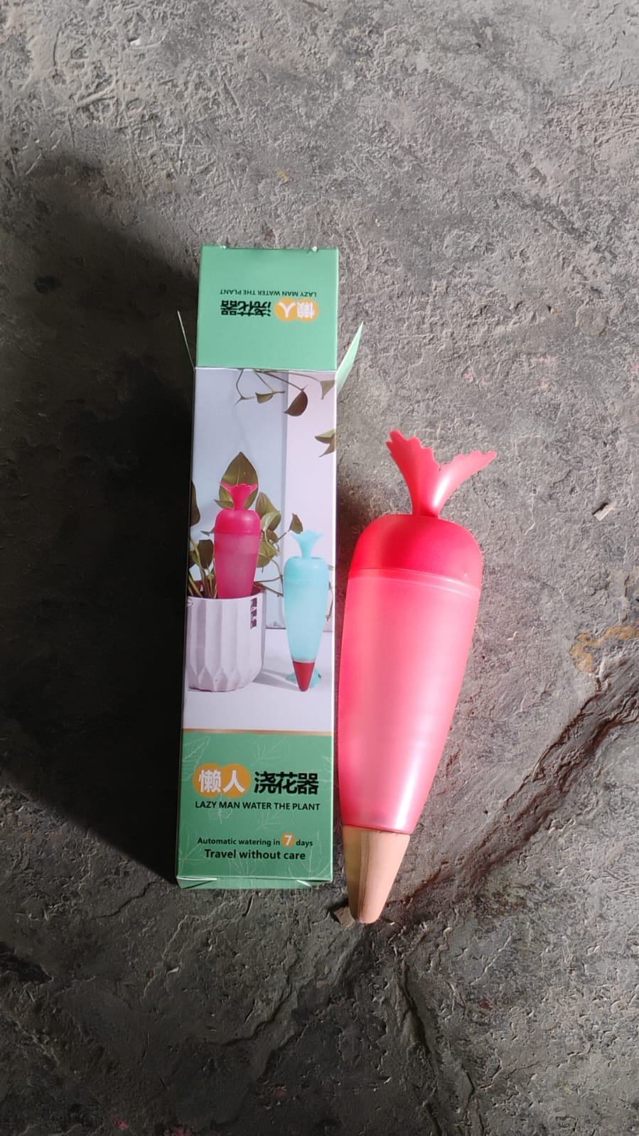 Product packaging for the self watering spike, showing brand logo.