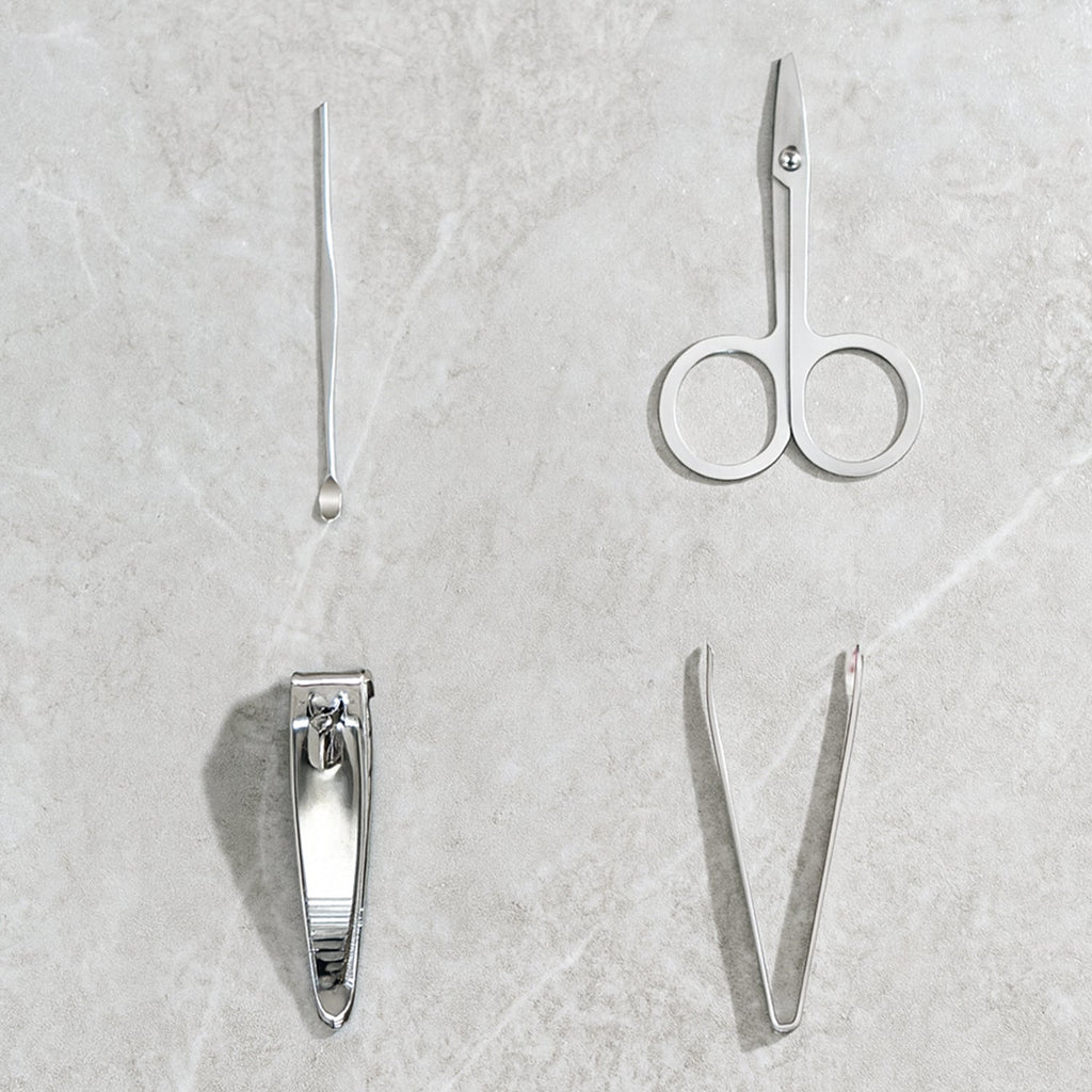 The AuriGlam 4-piece stainless steel nail clipper set displayed in its open case.