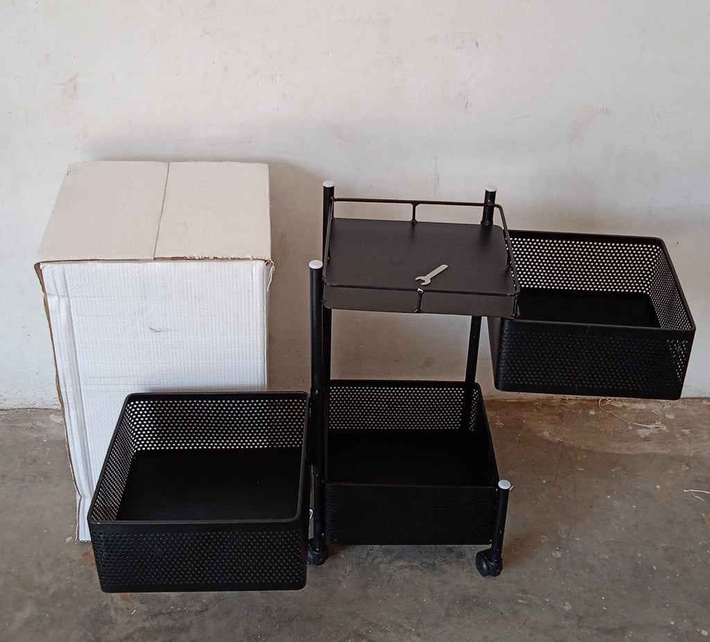 Fully assembled 3-layer metal kitchen trolley with wheels in a modern kitchen setting.