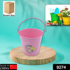 Galvanized metal planter bucket with handle, ideal for indoor or outdoor plants.