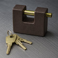 Front view of the heavy-duty black iron door lock with a brass core and five keys.