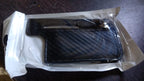 Mobile card pocket holder with adhesive backing for convenience.