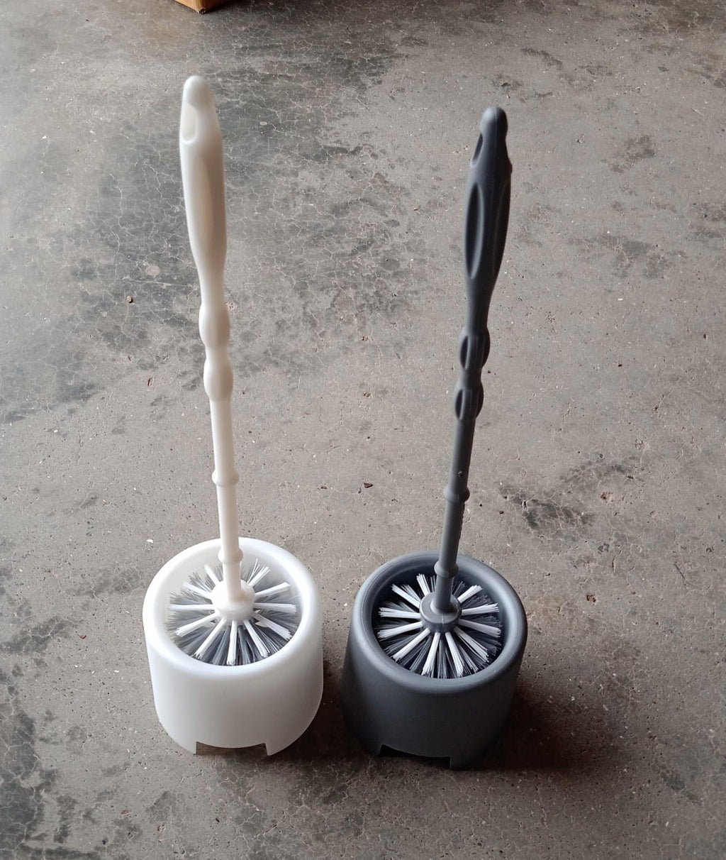 Side profile of the Pro Clean toilet cleaning brush and its compact potted holder.