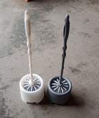 Side profile of the Pro Clean toilet cleaning brush and its compact potted holder.