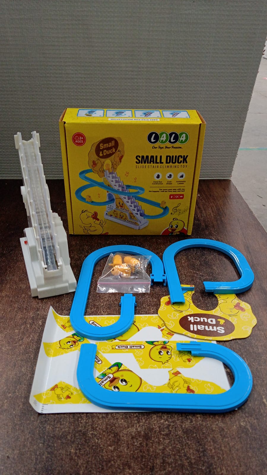 Small duck toy on staircase track designed for toddlers