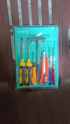 Using the 7-piece hand tool kit with magnetic wristband during repair work