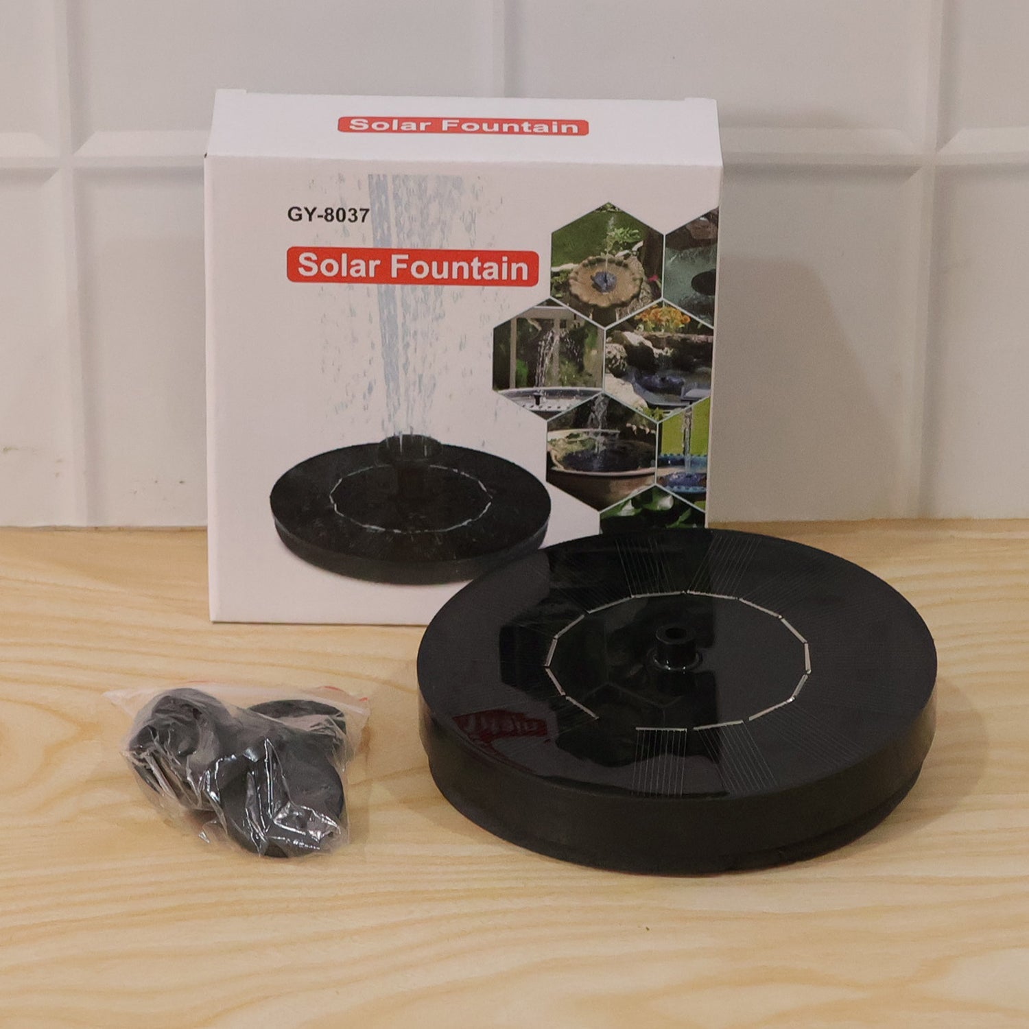 Fountain box packaging with solar panel and nozzles