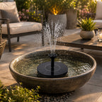 Fountain pump creating water spray on patio bowl