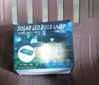Solar LED lamp packaging with product details.