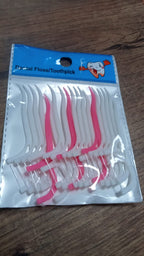 White dental floss picks with a textured grip.