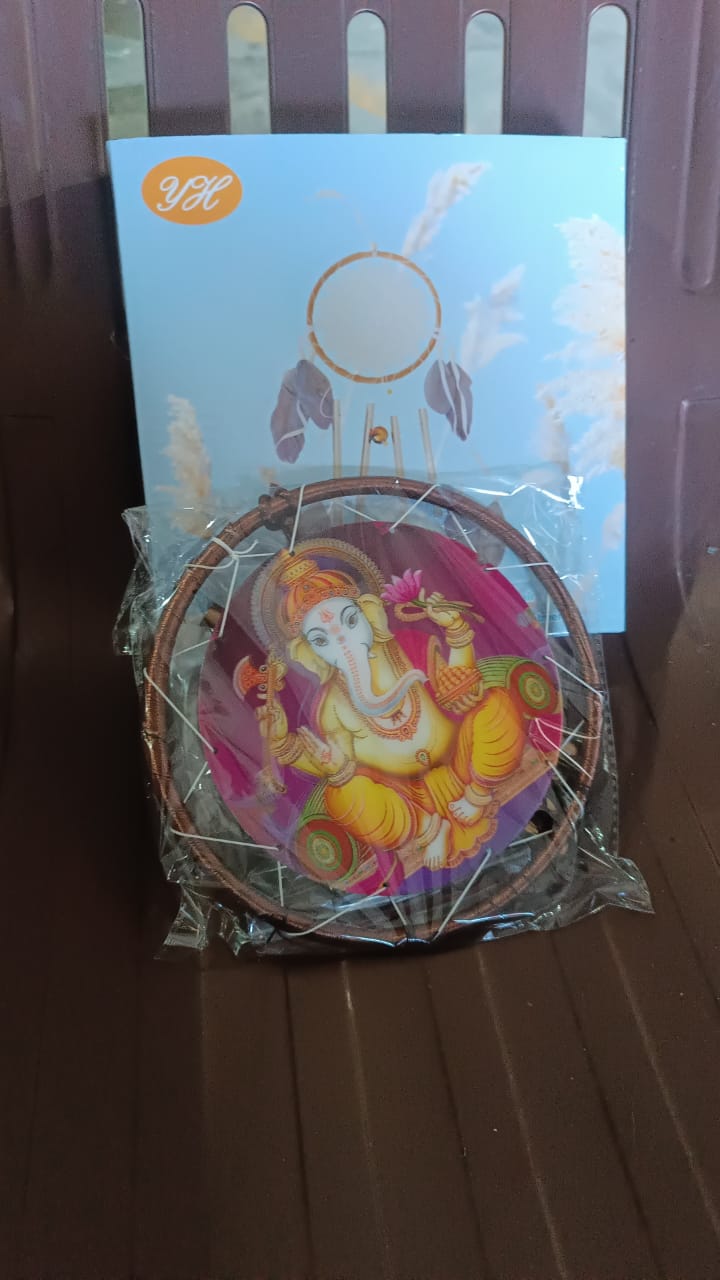 Vertical view of Lord Ganesh Wind Chimes in natural outdoor light