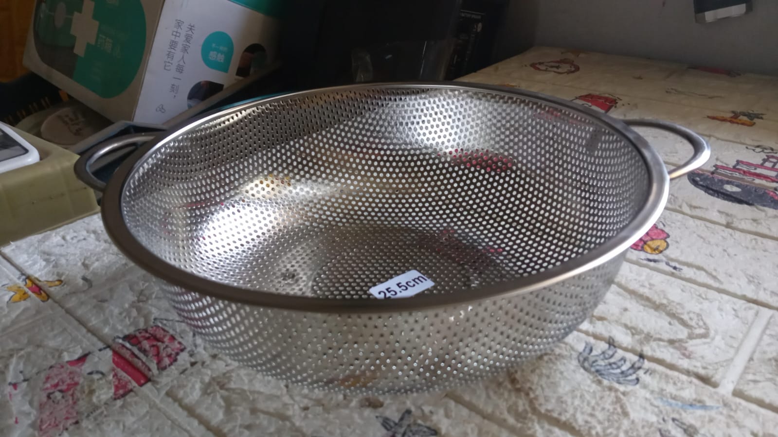 Angled shot of the versatile kitchen colander, ready for use.