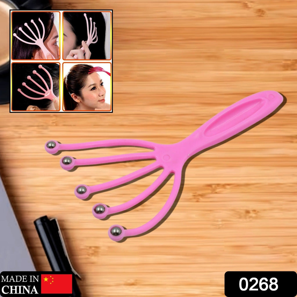 Close-up view of the ergonomic metal balls on the handheld scalp massager.