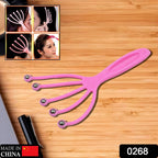 Close-up view of the ergonomic metal balls on the handheld scalp massager.