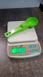 Stylish green plastic ice cream scoop for easy storage.