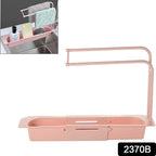 Expandable sink caddy showing dual towel bars and integrated drip tray for drying cloths
