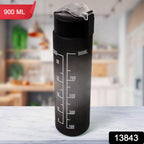 Ergonomic design of the black motivational water bottle with its integrated carry strap.