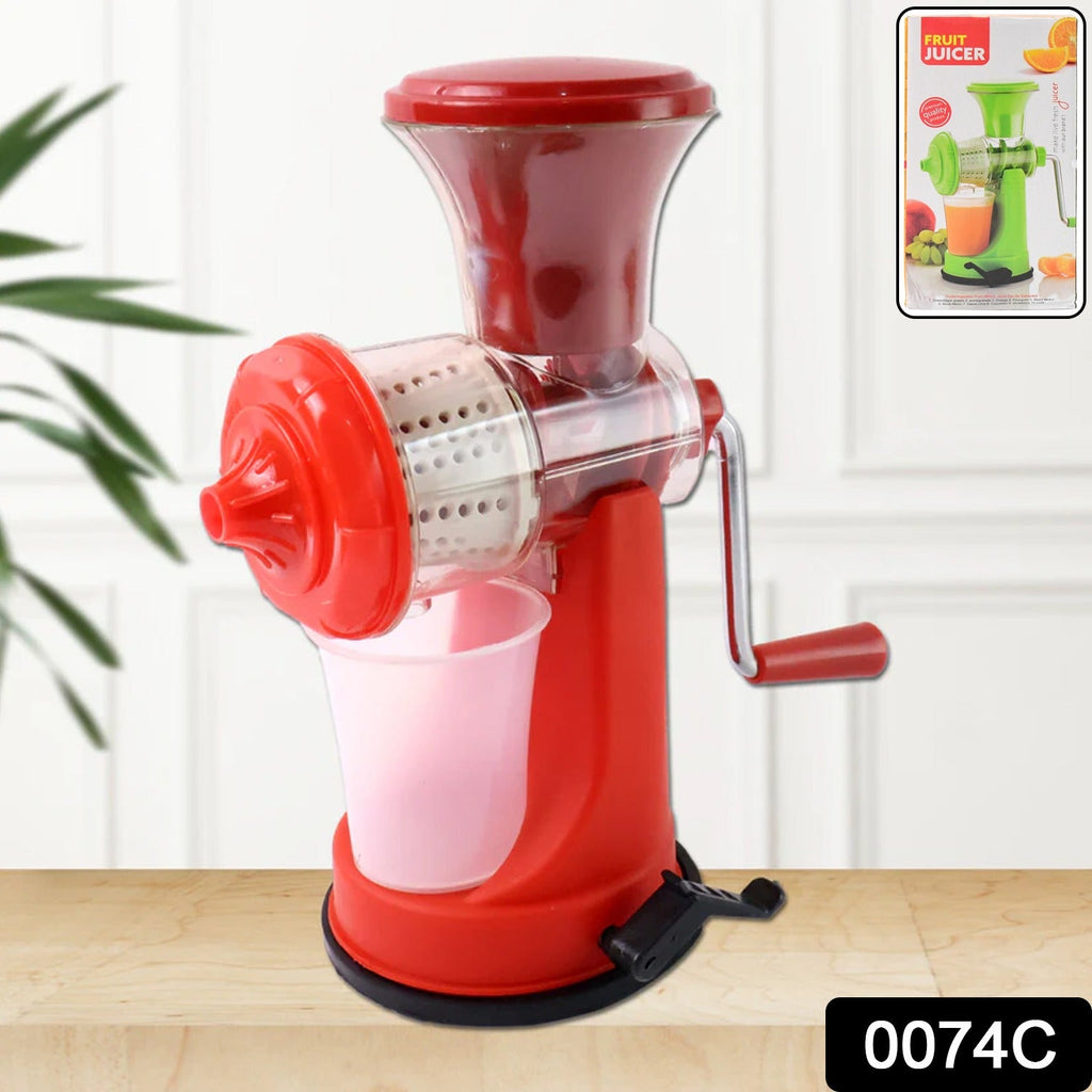 Grippy manual juicer firmly clamped to a kitchen counter, extracting fresh juice.