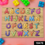Toddler hands engaging with the vibrant wooden ABC and shape learning puzzle.