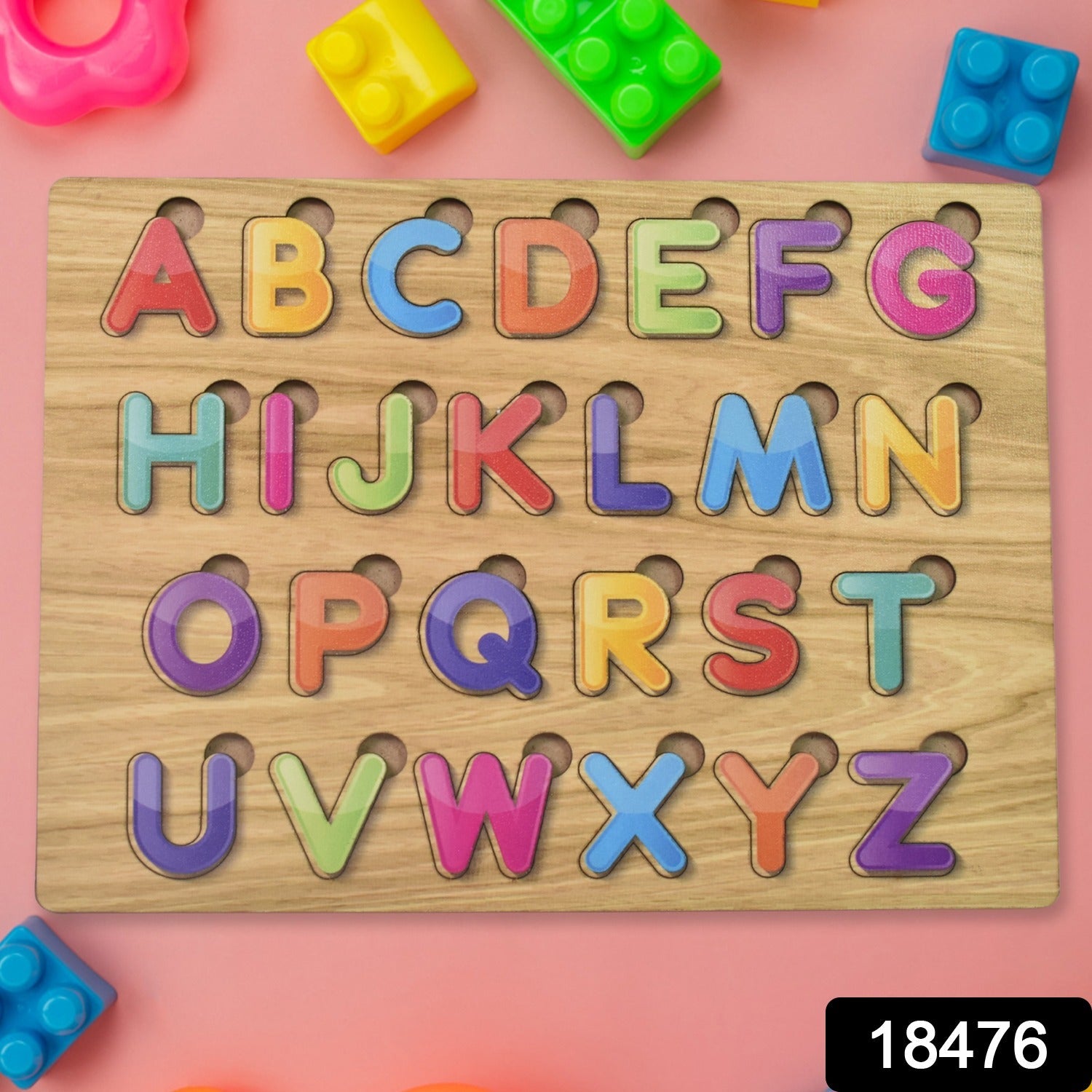 Toddler hands engaging with the vibrant wooden ABC and shape learning puzzle.
