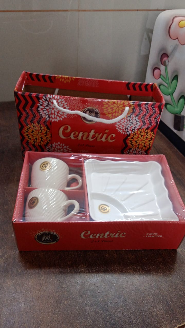 Close-up view of ceramic tea cups and the plastic serving platter in set