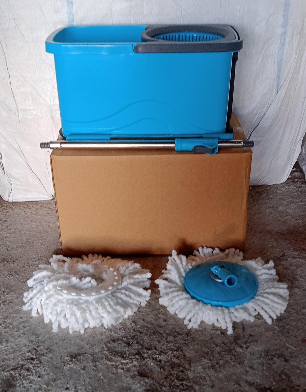 Pro Clean spin mop with plastic bucket, showing full assembly.