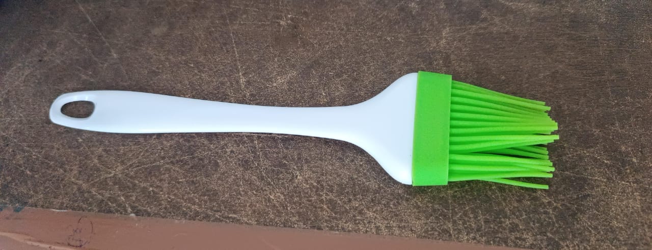 Silicone brush used for grilling and barbecues, part of CookAura kitchen utensils