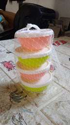 Small plastic bowls with lids placed inside a microwave oven, demonstrating safety.
