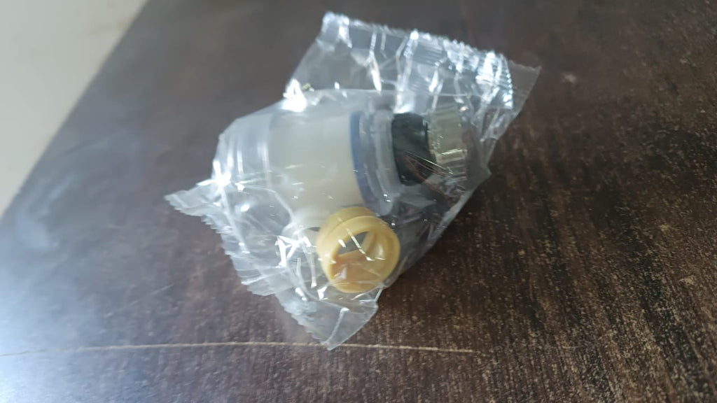 Detailed view of the water filter layers inside the swivel faucet aerator.