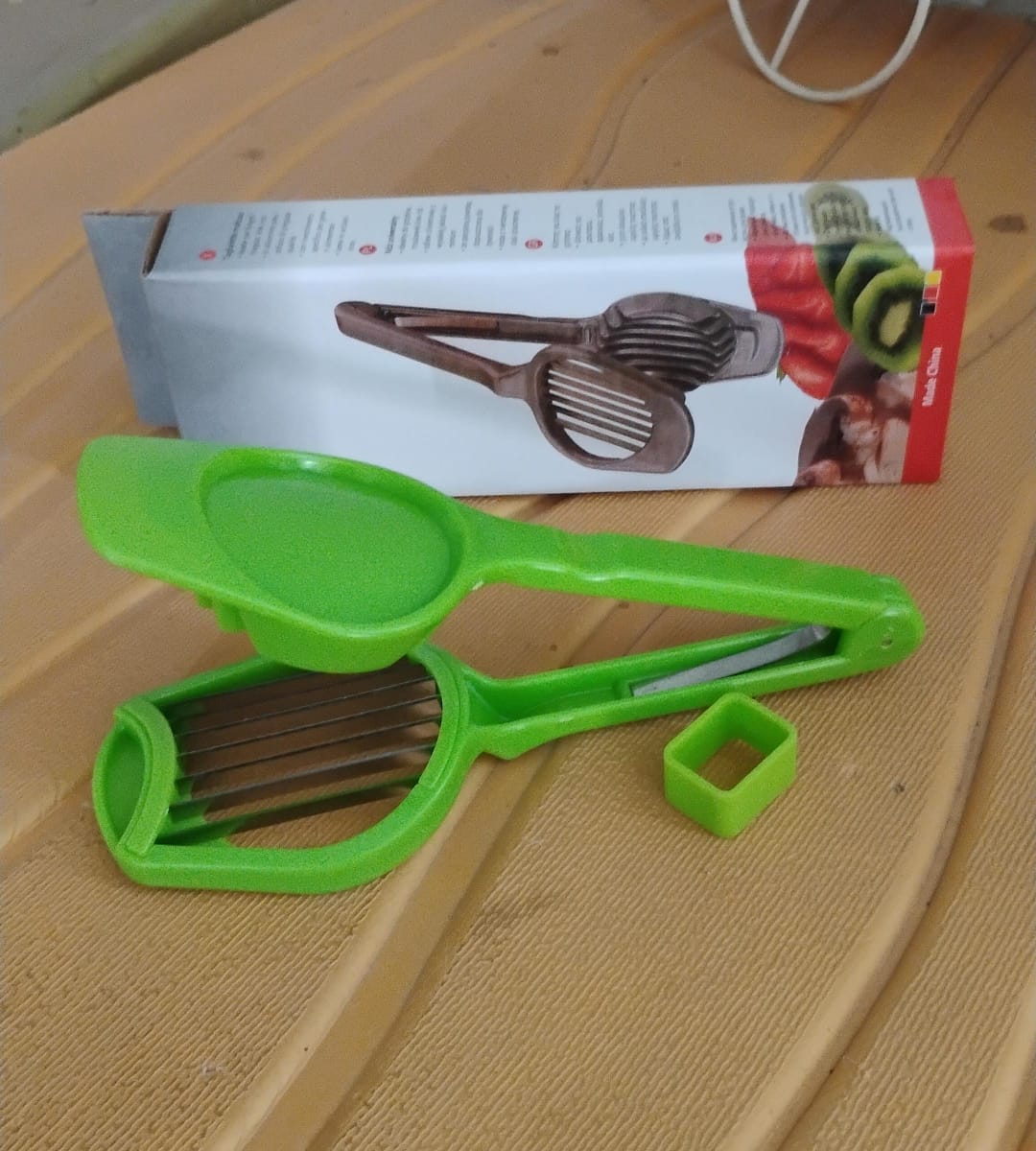 Side view of the ChefAura Multipurpose Slicer with its packaging.