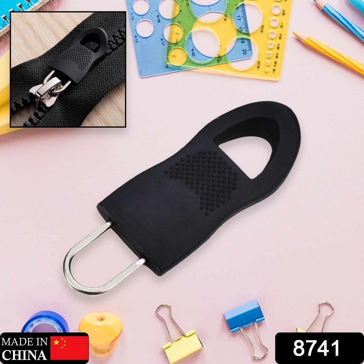 A hand demonstrating how to easily attach the zipper extension to a backpack's existing slider.