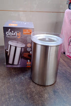 Konvex steel container filled with vibrant spices, highlighting its see-through lid.