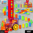 Child's hand interacting with the automatic domino train set in action.