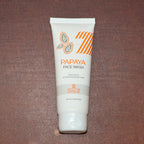 Papaya Face Wash tube shown with clean, dewy skin after use