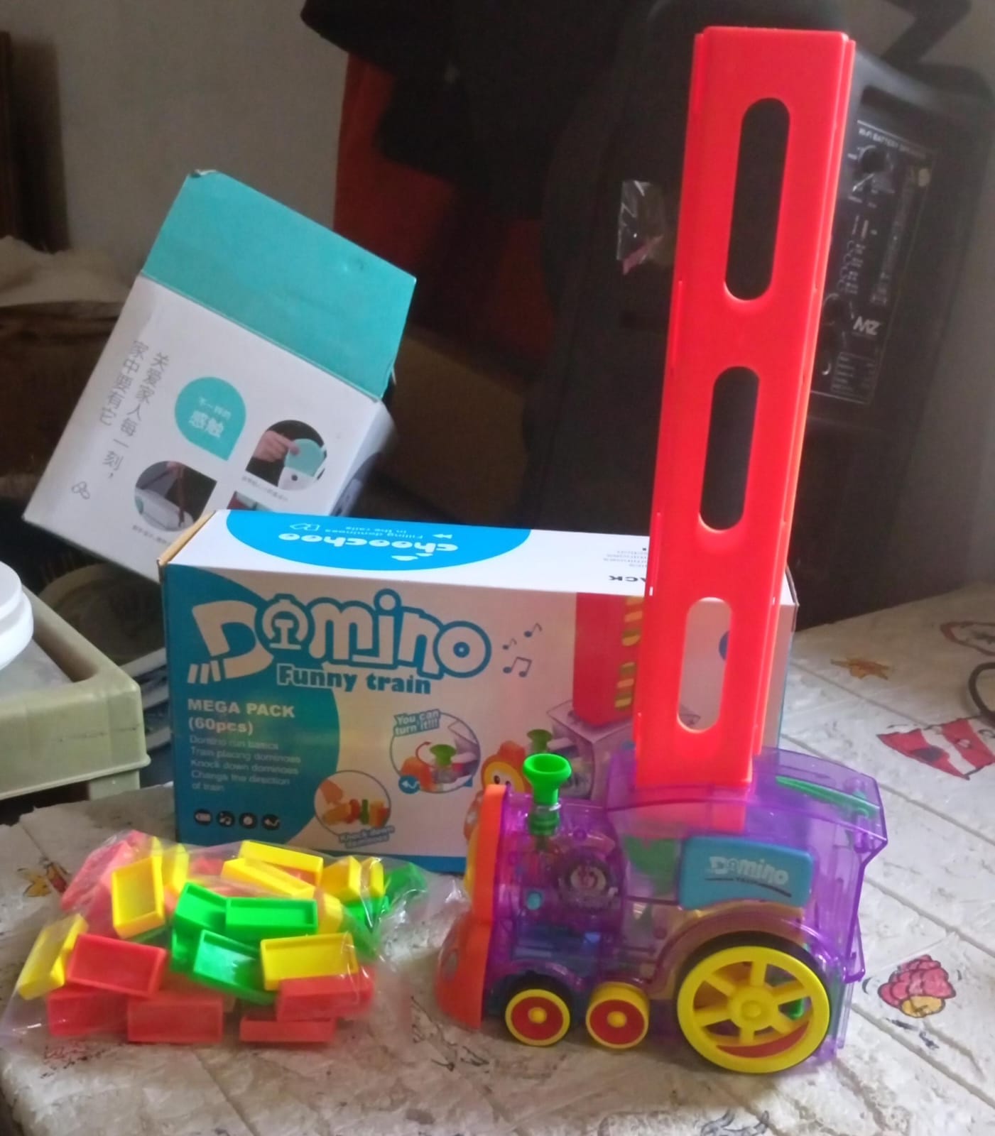 Transparent domino train engine creating a long, winding line of blocks.