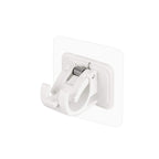 Wall-mounted adhesive towel holder showing towel rod and hooks