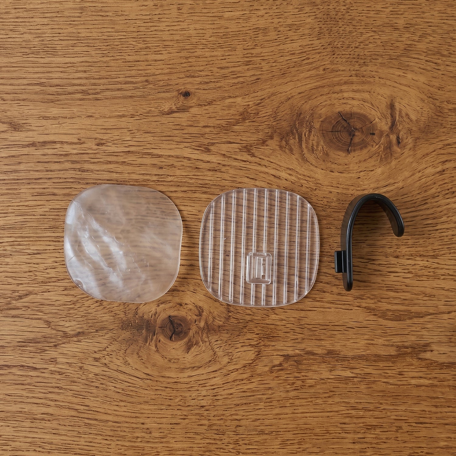 Self-adhesive wall hook for hanging household essentials