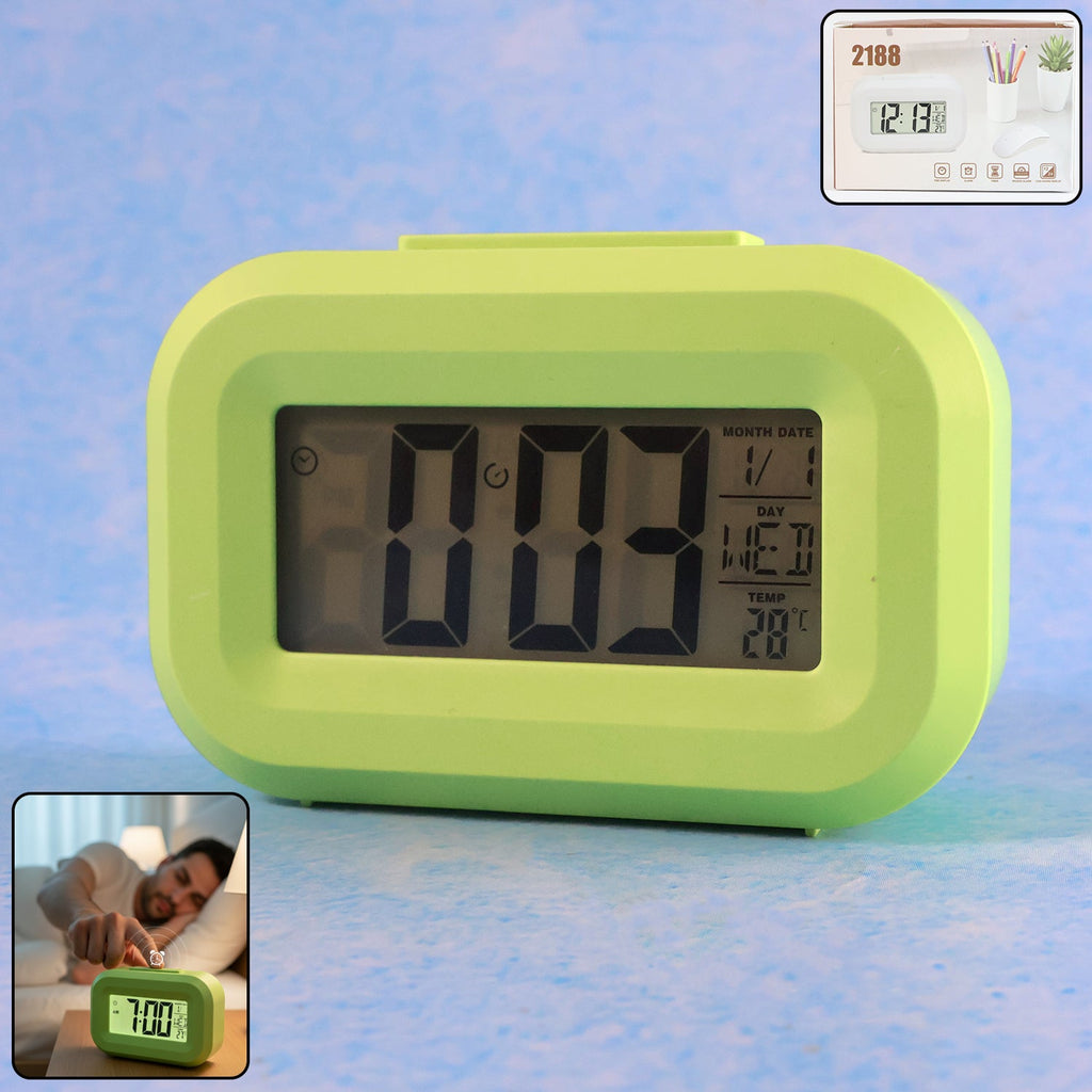 Digital alarm clock showing time, date, day, and temperature clearly on display
