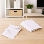 All purpose adhesive white labels neatly stacked and ready for use