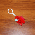 Lifestyle shot of a Pop-It Fidget Keychain being used by someone, emphasizing its role as a calming sensory toy.