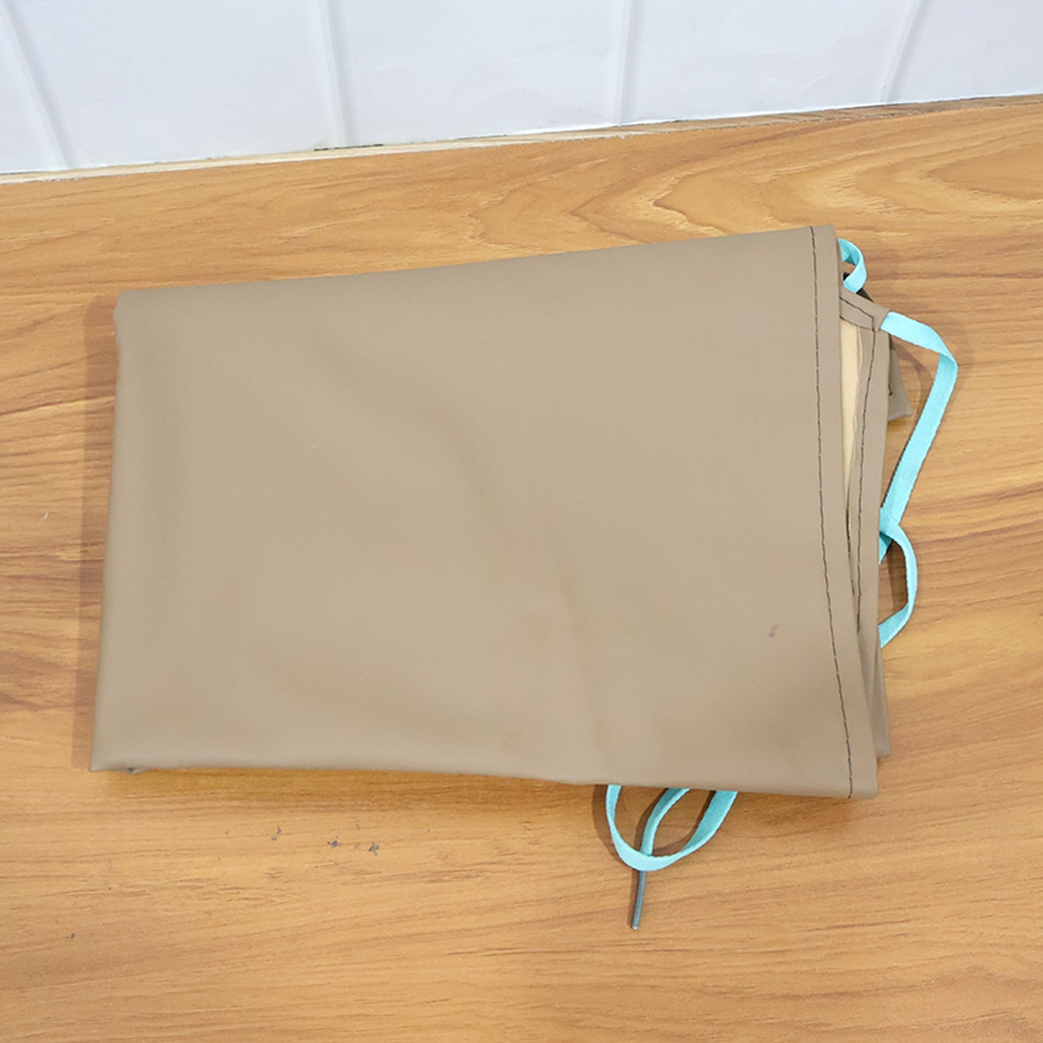 Close-up view of durable apron fabric and stitching