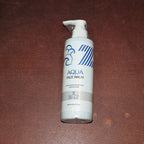 Lifestyle image of Hydrating Aqua Face Wash bottle in bathroom setting