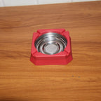 Heat-resistant ashtray in a home or office setting for ash disposal