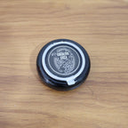 Ashtray placed on table showcasing windproof smoke control lid